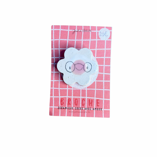 Broche fleur en céramique bleue avec visage souriant et lunettes, environ 3 cm, création Julie Petrolli
